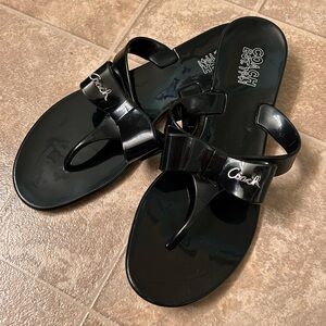 Woman’s Coach sandals, size 8.